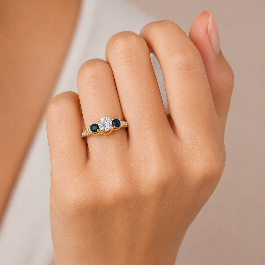 The Three-Stone Moti and Diamond Engagement Ring from our collection is a sophisticated choice for those who value cultural fusion in fine jewelry. By pairing the timeless brilliance of a 0.97tw round-cut diamond with the classic luster of Moti, this ring creates a beautiful contrast that stands out from traditional solitaire designs.