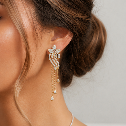 Hop elegant floral drop diamond earrings featuring cascading gold chain. Handcrafted with 130 sparkling diamonds and available in BIS Hallmarked 14K or 18K gold. These luxury statement earrings are the perfect choice for bridal wear, festive events, and special occasions. Buy premium gold and diamond jewellery online.