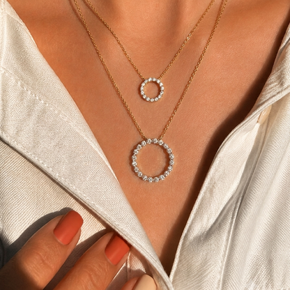 Shop this stylish double-circle diamond pendant.  Featuring 35 diamonds set in 14K or 18K gold, this layered pendant is a perfect choice for modern, everyday jewellery. Browse our collection of fine diamond pendants for women.