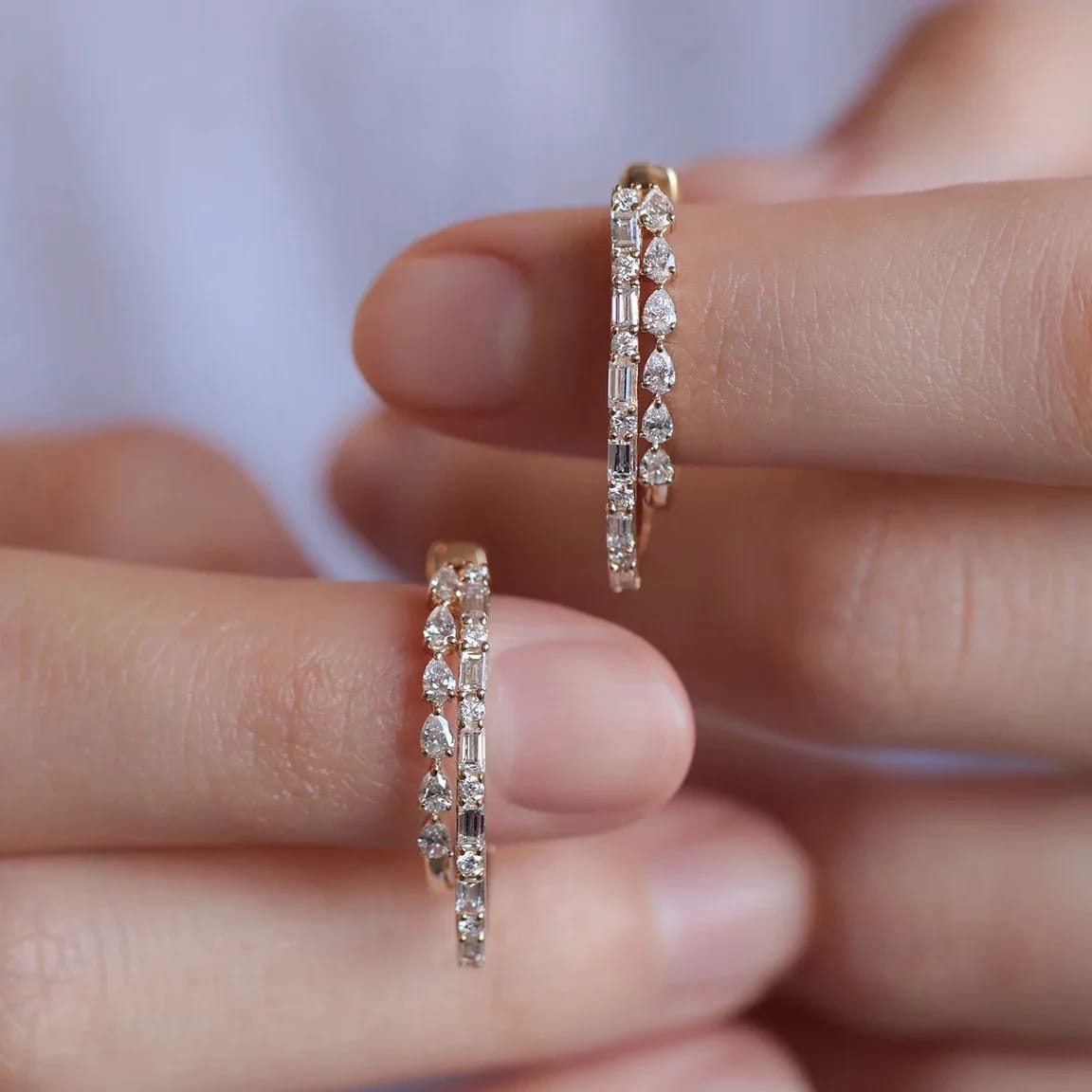 Elevate your look with these elegant double-row diamond hoop earrings. Featuring 36 brilliant diamonds set in premium 14K or 18K gold, these modern huggies are perfect for daily wear or sophisticated occasions. Shop fine handcrafted diamond jewellery online.