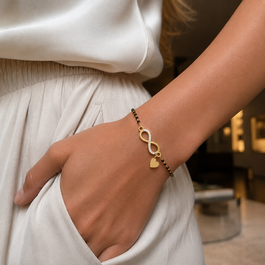 Discover the Eternal Heart Embrace Bracelet. A sophisticated infinity loop design accented with a heart charm, featuring 14 brilliant-cut diamonds. Expertly crafted in 14K or 18K gold.  The ideal choice for those researching symbolic, high-quality gold and diamond jewellery.