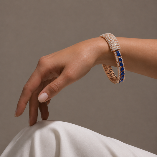 Discover the Ethereal Prism statement bangle, featuring a premium blend of deep-hued baguette stones and 218 brilliant-cut diamonds. Expertly crafted in 14K/18K gold, this luxurious cuff bracelet is perfect for bridal wear or high-end formal occasions. Elevate your fine jewellery collection with this artisan-designed, high-carat gold masterwork.