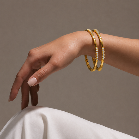 Shop our Luminous Infinity Diamond Bangle online. This stunning piece features 84 brilliant-cut real diamonds in 18K & 14K BIS Hallmarked gold. Perfect as daily wear diamond jewellery for women, festive gifts, or bridal accessories. Explore the latest trending diamond jewellery designs and premium gold bangles at Tathyaa.