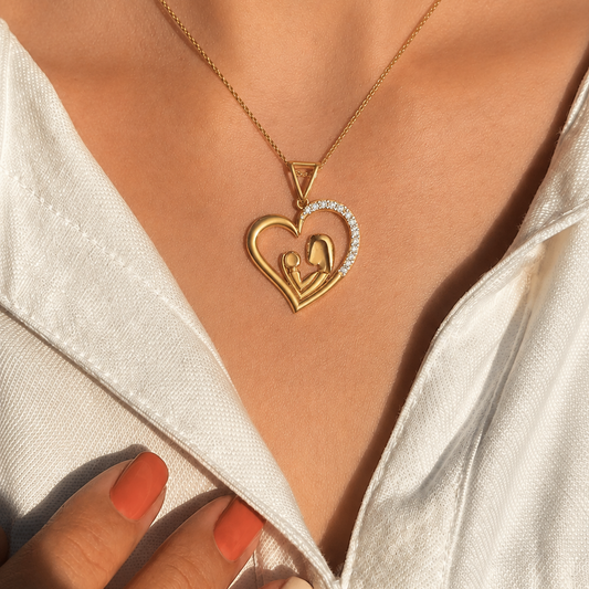 Discover the sentimental beauty of this mother and child diamond heart pendant. Featuring 12 brilliant-cut diamonds set in high-quality 14K or 18K gold, this meaningful piece is the perfect gift for mothers. Shop handcrafted, symbolic fine jewellery online.