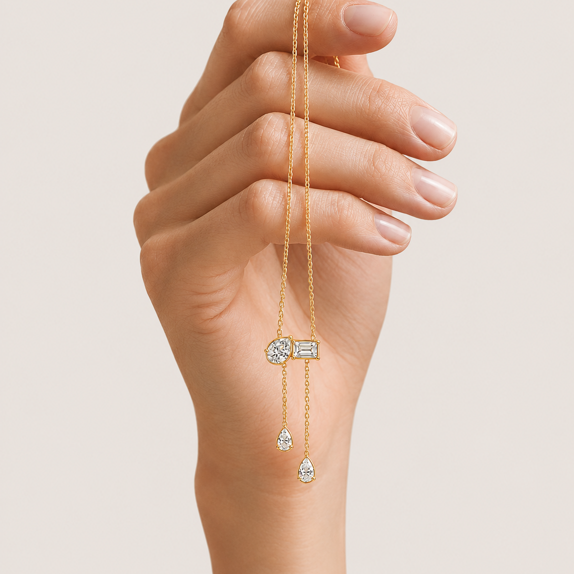 Elevate your everyday style with our elegant Pear and Emerald-Cut Duo Pendant (Model PD3217). This modern, minimalist design beautifully combines a pear-cut stone with two emerald-cut stones in premium 14kt or 18kt gold. Perfect for those who appreciate sophisticated, geometric elegance, this pendant is a must-have addition to your luxury jewelry collection. Shop this refined piece today.