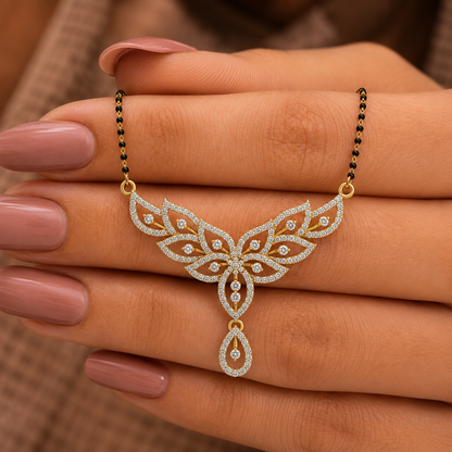 Elevate your bridal ensemble with The Celestial Lotus Petal Diamond Mangalsutra Pendant, featuring an ornate, 40mm wide floral design set with 165 brilliant diamonds. Available in 14K or 18K gold, this artisan-crafted piece serves as the ultimate symbol of grace and timeless festive luxury. 