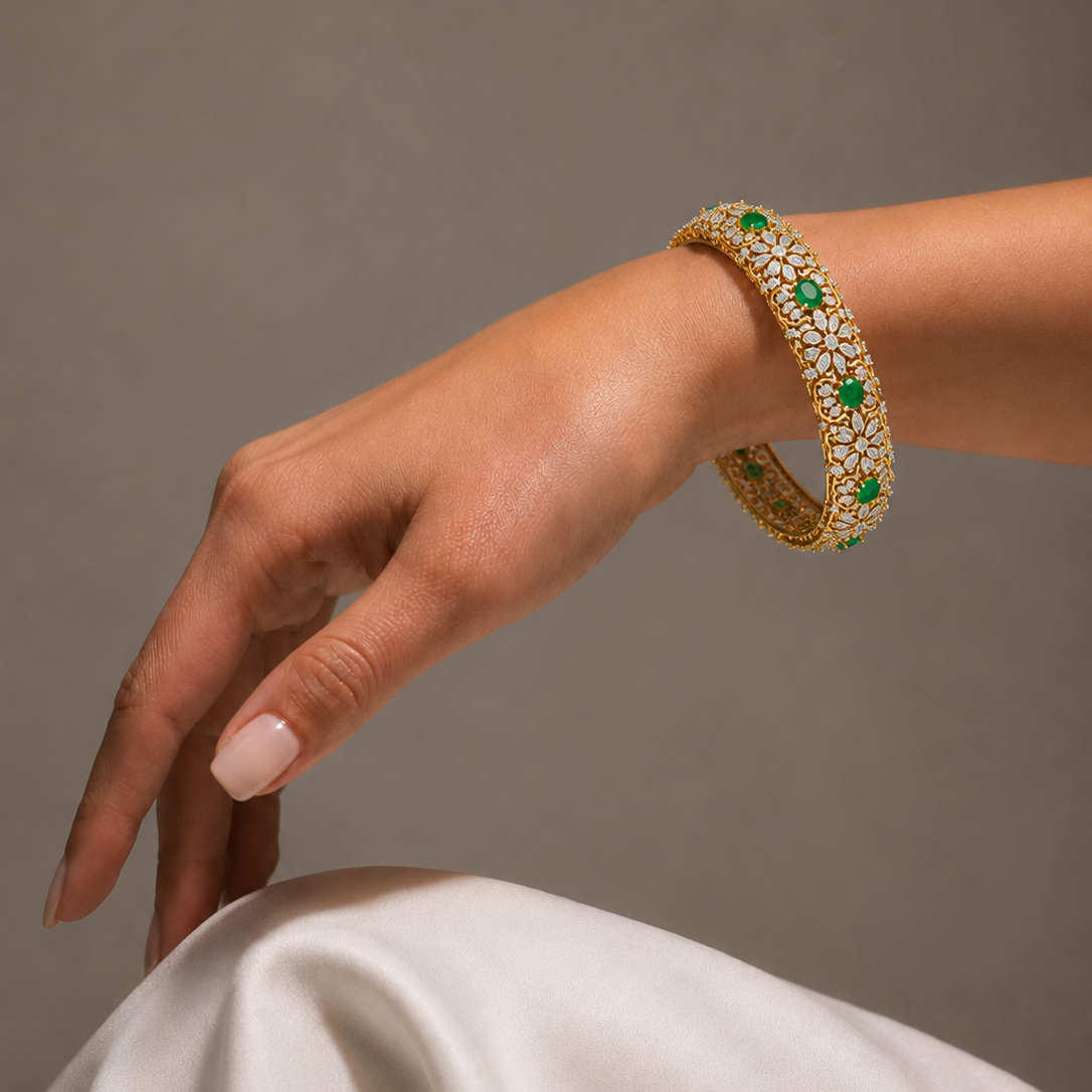 Discover The Emerald Filigree Heirloom Bangle Set, an exquisite blend of vibrant oval emeralds and 456 diamonds. Handcrafted in 14K or 18K gold with a delicate filigree design, this luxurious bangle set is the ultimate statement piece for weddings and special occasions.