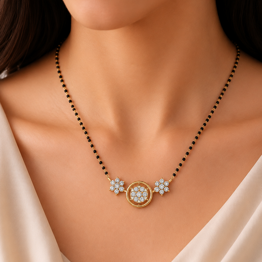 Elevate your radiance with The Floral Solstice Diamond Mangalsutra and Earring Set. Boasting 35 total brilliant diamonds set in BIS-hallmarked 14K& 18K gold, this set is the perfect fusion of modern grace and traditional charm.