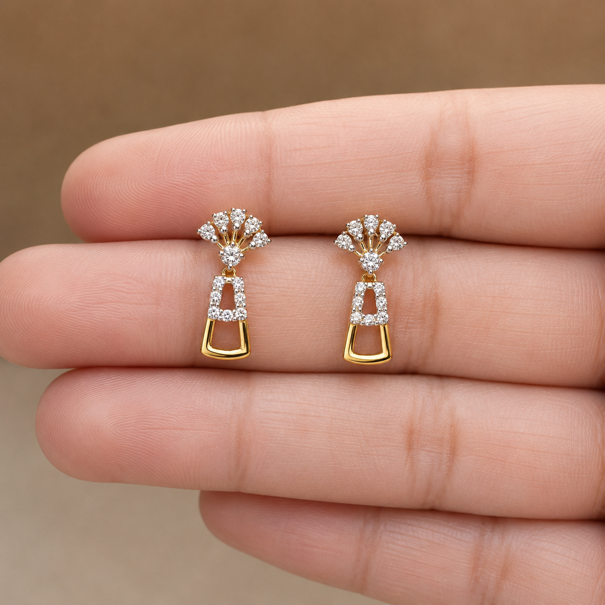 Discover The Geometric Luxe Fan Earrings, featuring a striking fan-shaped design with 38 brilliant diamonds set in 14K or 18K gold. These artisan-crafted, modern earrings are the perfect architectural accent for any elegant occasion. 