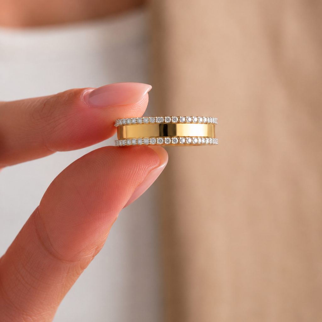 Experience the innovative artistry of The Infinite Interlocking Band Ring. This exceptional ring features a clever, kinetic design that pivots to showcase a brilliant channel of princess-cut diamonds framed by polished gold. Crafted with precision in 14kt or 18kt gold, this piece is the ultimate choice for those who seek modern luxury with a unique, interactive element. Elevate your jewelry collection with the sophisticated, dynamic beauty of this signature band.