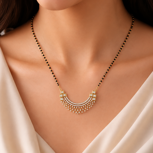 The Regal Lattice Horizon Diamond Mangalsutra Pendant, featuring a stunning 55mm crescent design adorned with 109 brilliant diamonds. Handcrafted in 14K or 18K gold, this artisan-made piece is the ultimate statement of modern bridal elegance and festive luxury. 