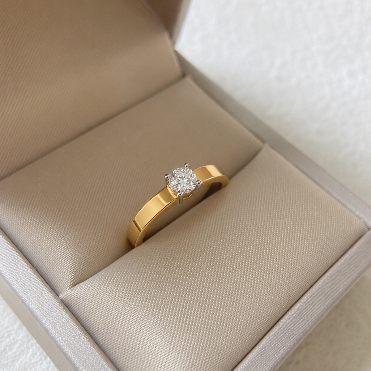 Discover The Timeless Solitaire Comfort Band, crafted for effortless elegance in BIS Hallmarked 14K or 18K gold. This artisan-made ring features a classic, secure four-prong solitaire setting, perfect for luxury gifting or as a refined everyday engagement piece. 