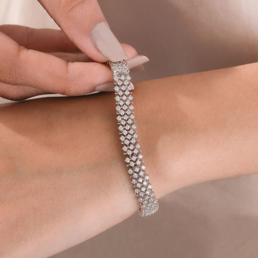 Elevate your daily style with our Triple-Row Diamond Bracelet. The perfect luxury accessory for office wear or everyday chic.