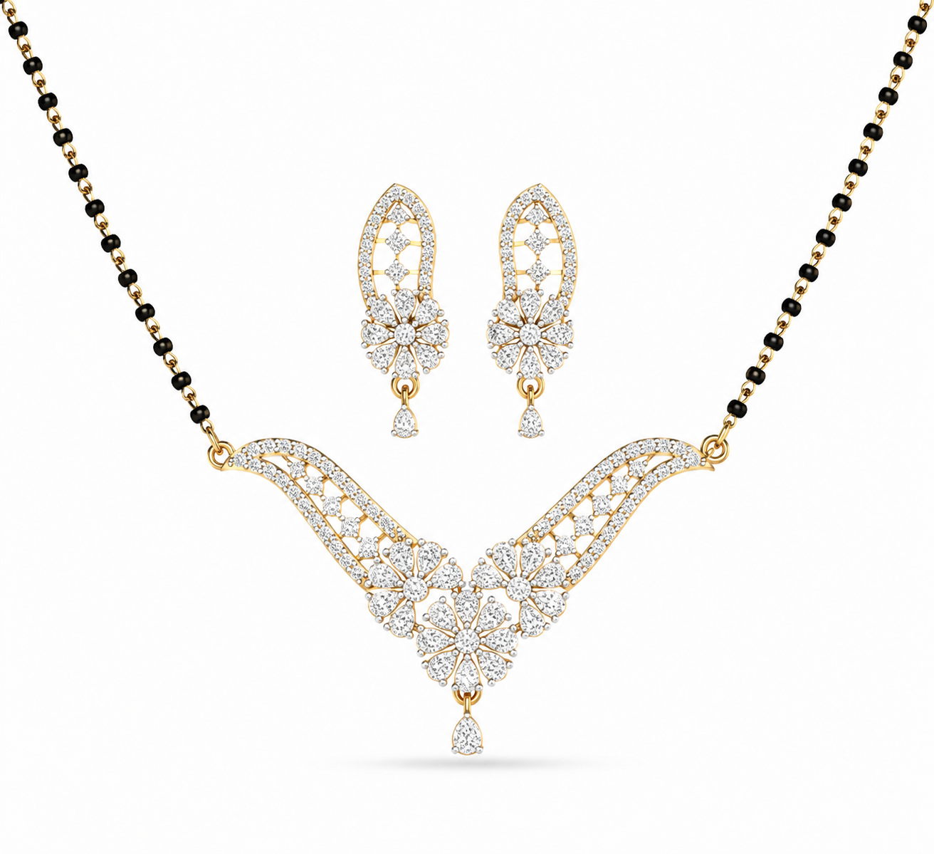 lluminate your traditional look with The Royal Fern Diamond Mangalsutra and Earring Set, a masterpiece featuring a V-shaped pendant and matching earrings adorned with 95 diamonds. Crafted in 14K or 18K gold, this set brings unmatched grace and luxury to every bridal moment. 