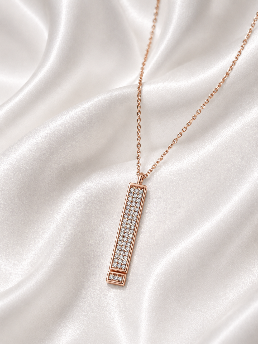Bar Pendant featuring a diamond pave case that pulls down to reveal a hidden engraved 'I LOVE YOU' message.